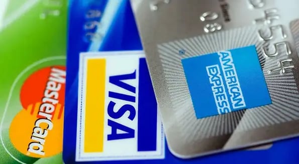 American Express pays businesses to accept its cards in a bid to catch Visa and others